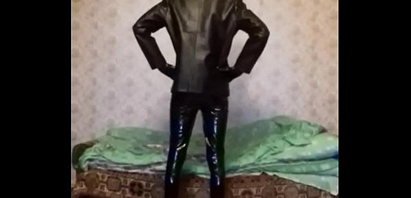  Guy in latex mask and latex shorts, vinyl pants and gloves